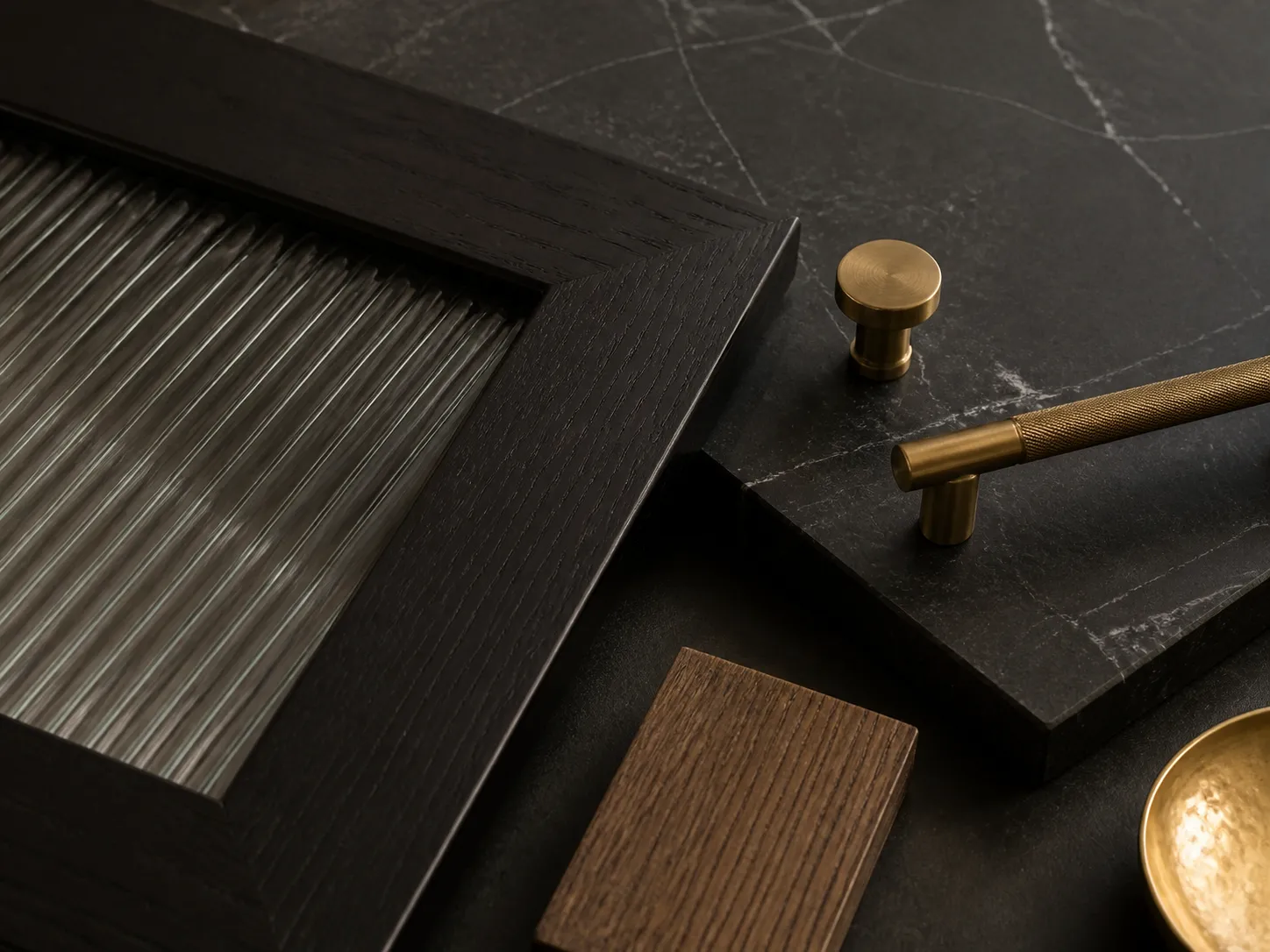 Design concept: black glass cabinet fronts with a black stone countertop