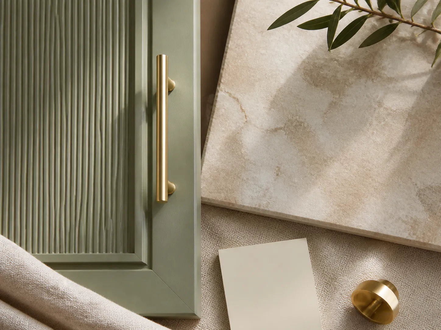 Design concept: sage reeded cabinet fronts with a warm stone top